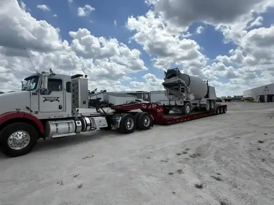Heavy haul trucking — concrete mixer on a lowboy trailer