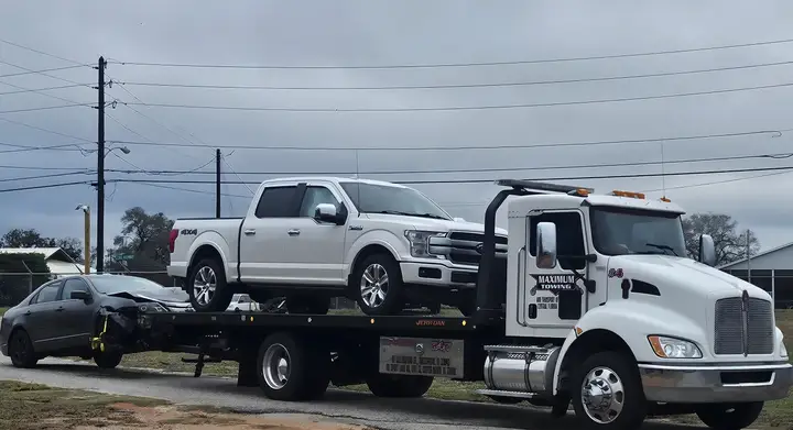 Heavy equipment transport in Kissimmee — loaded truck